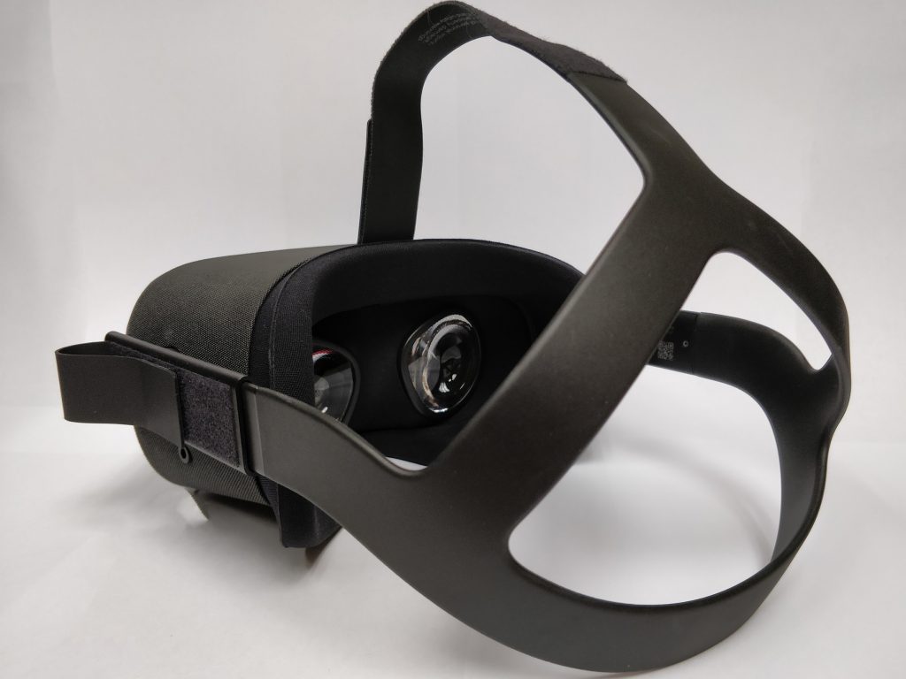 The Oculus Quest from the rear and side, showing the lenses inside the headset through the head strap.