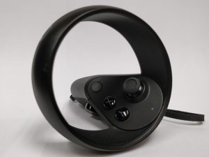 A better view of the Oculus Quest controller, showing the buttons, joystick, and the top ring.