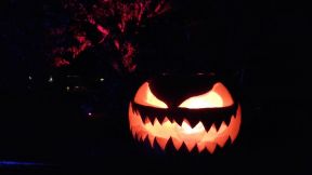 Halloween 2019 ghoulish pumpking glwoing in the night.